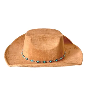 Close-up detail of the vintage brown suede western cowboy hat featuring a stylish turquoise chain.