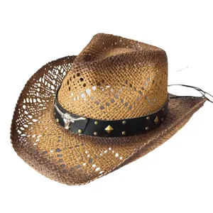 Close-up detail of the brown woven straw cowboy hat with black leather band and silver skull accent.