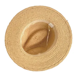 Detailed top view of a classic raffia straw hat showing fine weave texture and interior label.
