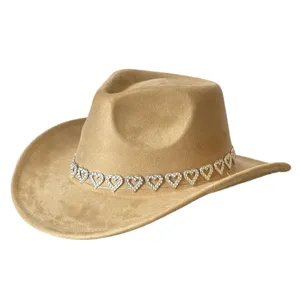 Rhinestone heart band detail on suede cowboy hat surface, close-up view of vintage style party hat