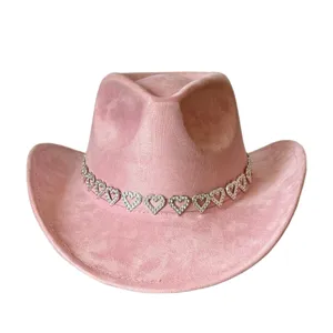 Close-up detail of the pink western cowboy hat with a sparkling rhinestone heart chain band.