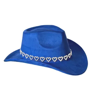 Detailed view of blue suede cowboy hat featuring sparkling rhinestone heart chain band trim.