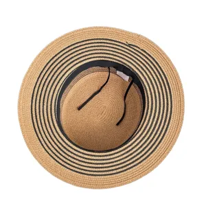 Stylish women straw hat for summer beach vacation with black stripes and wind rope.