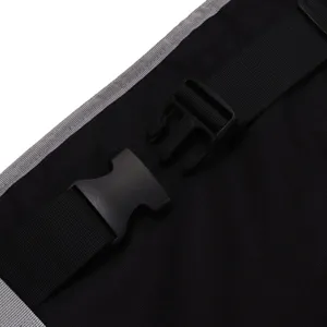 Close-up detail view of travel airplane footrest and portable kids seat extender strap.