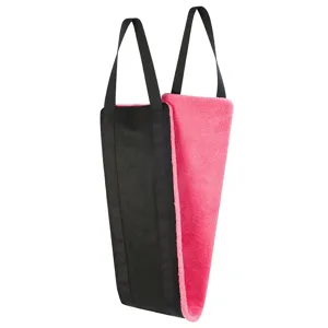 Detailed view of the dog lift support sling featuring soft pink plush lining and durable handles.