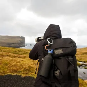 Outdoor carabiner clip for camping, hiking and travel gear attachment with secure D-ring design.
