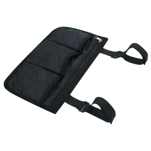 Detail view of black quilted wheelchair side storage bag with multiple pockets and secure straps.
