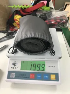 Dog lift harness weight detail shot, portable grey storage pouch with pet recovery support strap.