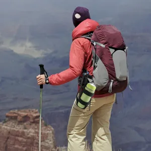 Hiking water bottle pouch detail shot showing practical outdoor gear application in nature.