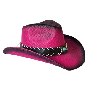 Close-up detail of pink and black gradient western cowboy straw hat with turquoise buckle.