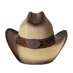 Chapeau de cowboy western vintage en paille avec large bord et bande en cuir decorrative.