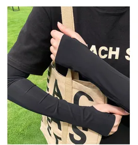 Detail view of black ice silk sun protection arm sleeves with thumb holes for outdoor riding.