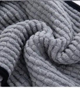 Close-up of soft gray chenille pet towel fabric, showing thick texture and super absorbent.