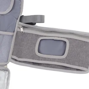 Close-up detail of grey portable baby diaper bag with zipper pocket, mesh storage and window.