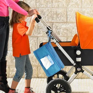 Portable foldable baby diaper changing pad bag for stroller with waterproof hanging blue design.