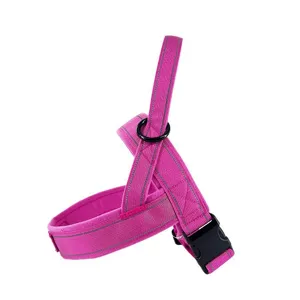Durable pink dog harness with reflective safety strips, comfortable vest style for outdoor walking.