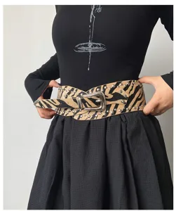 American western style studded wide belt for women, fashionable waist accessory design.