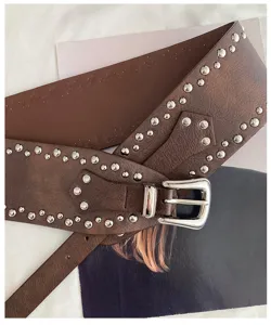 Women's American western style wide studded belt retro punk leather waist band fashion accessory.