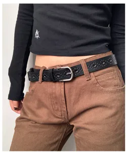 Women's black hollow-out leather belt with vintage metal pin buckle, chic casual jeans waist accessory.