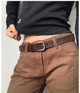 Women's brown hollow pin buckle leather belt, stylish casual accessory for jeans and pants.
