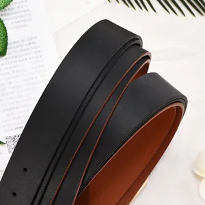 Women's casual minimalist leather belt with classic black and brown double-sided reversible design.