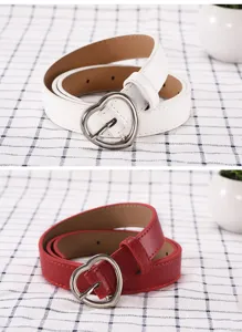 Stylish women's leather belt with cute heart buckle, casual jeans waist accessory detail.