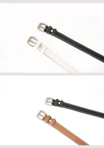 Detailed view of women casual leather belt featuring double stitching and metal pin buckle.