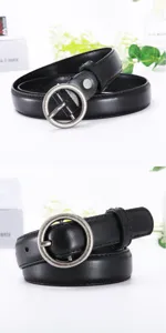 Detailed close-up of a women's black leather belt featuring an antique silver round metal buckle.