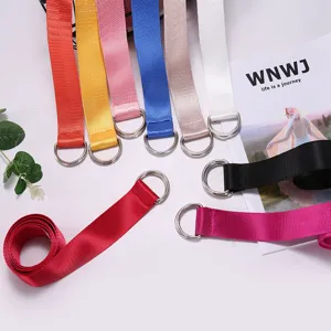 Versatile canvas belt with double ring buckle, fashionable accessory for men and women daily use.