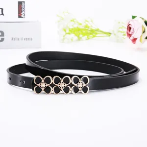 Women's elegant black thin leather belt featuring a stylish floral metal buckle for dresses.