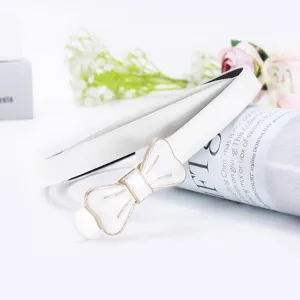 White skinny belt for women, elegant gold-trimmed bow buckle dress belt for fashion outfits.