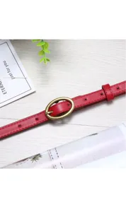 Women red thin faux leather belt with vintage oval pin buckle for jeans and daily wear styling.