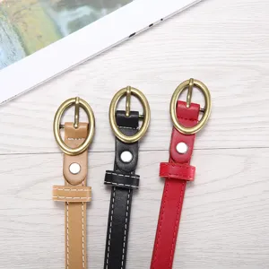 Women thin leather waist belt with gold oval pin buckle, versatile accessory for jeans.