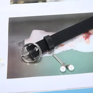 Fashion women black leather belt with round metal buckle and pearl charm for casual jeans.