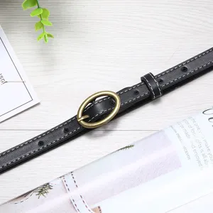 Women minimalist thin leather belt with gold oval buckle, perfect for jeans and dresses.