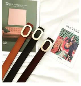 Minimalist women's leather belt with metal oval buckle, chic casual waist belt for jeans.