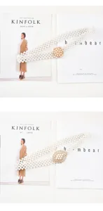 Elegant women's pearl elastic waist belt with rhinestone buckle for dresses and coats.