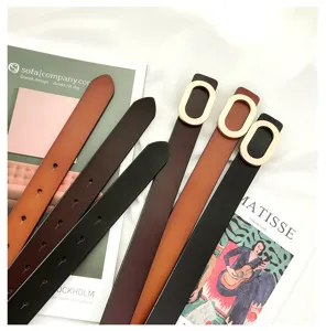Detailed view of women's leather belt with oval buckle casual fashion waist accessory.