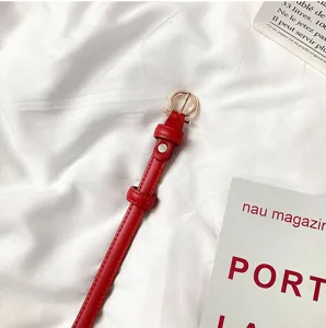 Women red skinny belt for dresses, stylish candy color waist belt with round metal buckle.