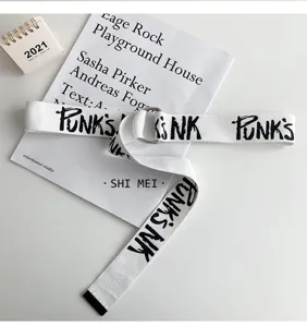 Trendy white canvas belt with black letter print and metal double ring buckle, streetwear style.