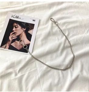 Metal pants chain accessory detail view, stylish hip hop silver chain for jeans and bags.