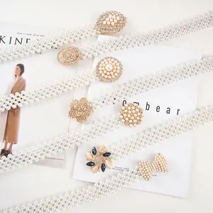 Elegant pearl elastic waist belt with sparkling rhinestone buckle, perfect for dresses and coats.