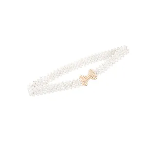 Elegant white pearl elastic waist belt with sparkling bow buckle for dresses and coats.