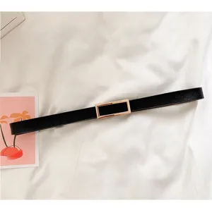 Minimalist black women belt featuring a sleek rectangular gold buckle detail for stylish daily wear.
