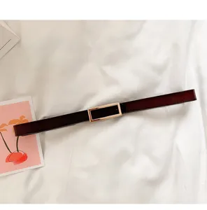 Minimalist women thin leather belt with gold rectangular buckle for coats and daily styling.