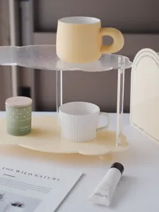 Detailed close-up view of the modern minimalist acrylic desktop storage rack with cloud tiers.