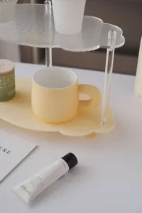 Detail shot of the clear and yellow acrylic cloud storage shelf showcasing fine craftsmanship.