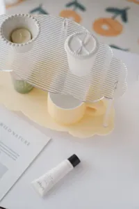 Clear acrylic cloud tiered desktop storage rack detail view, minimalist home decor organizer.