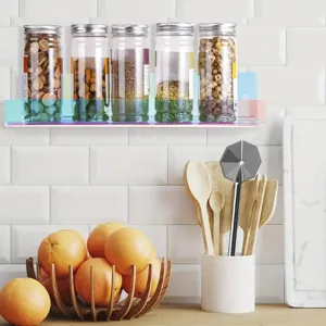 Colorful acrylic wall mounted storage shelf detail showing spice jars arrangement in kitchen setup.