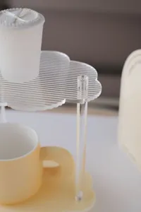 Acrylic desktop storage shelf detail view featuring cloud tray and clear pillar structure.